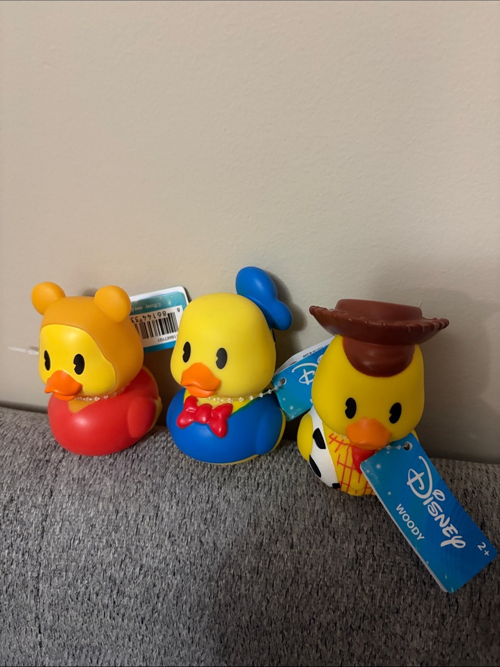Disney Yellow Duck Toy Set with Blue, Brown, Red Accents